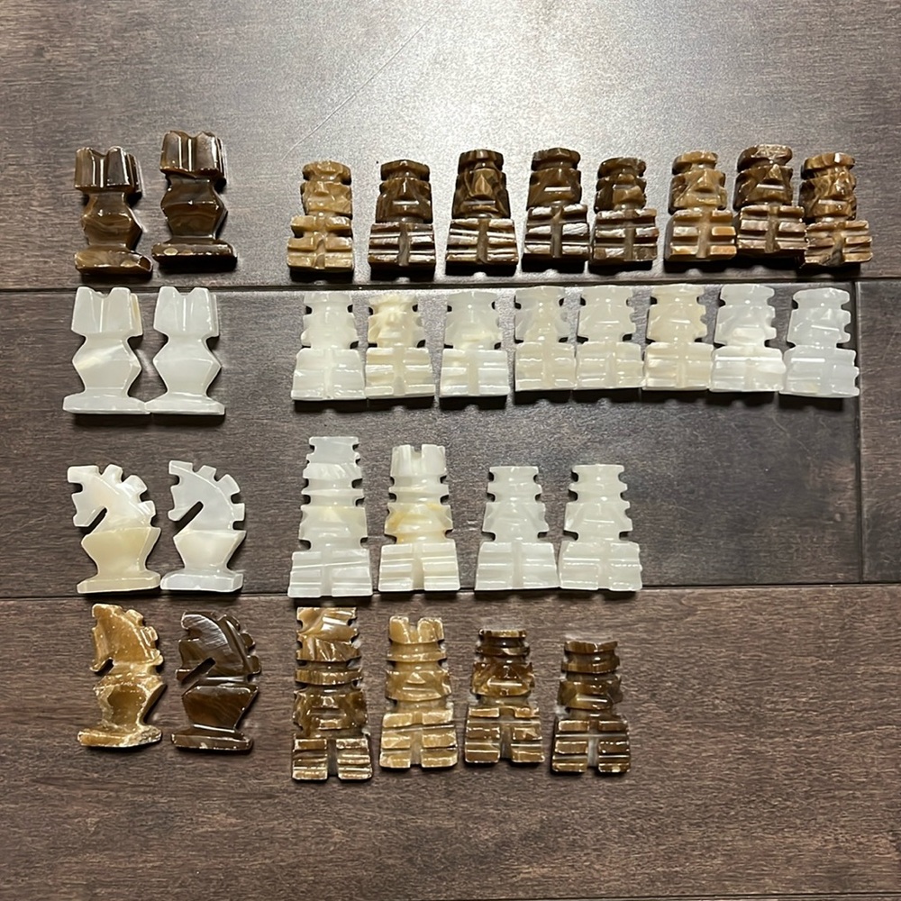 Set of Aztec stone chess figures, hand carved
